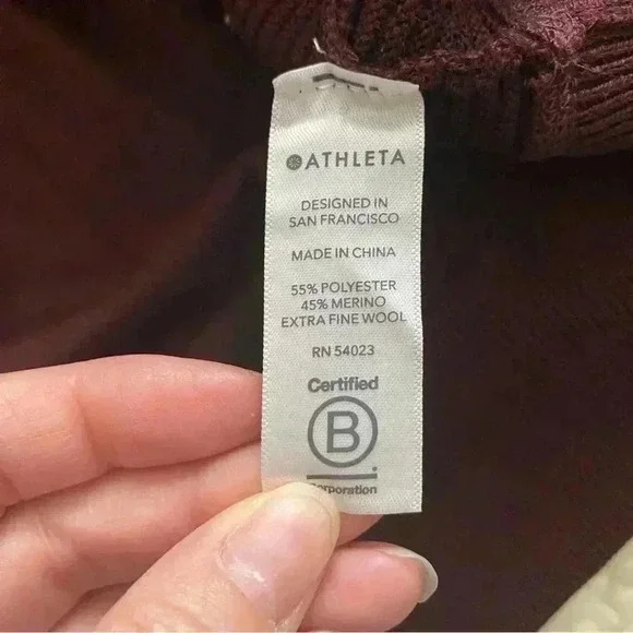 Size m Athleta Burgundy sweater with stripes on the sleeves. - Picture 5 of 6
